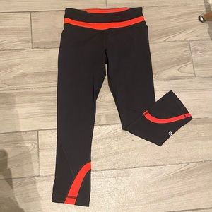 Lululemon run inspire crop leggings - size 4, black and orange